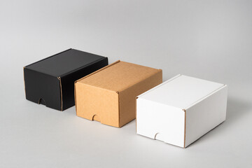 Set of black, brown and white cardboard boxes, isolated
