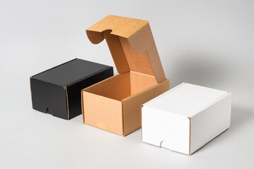 Set of black, brown and white cardboard boxes, isolated
