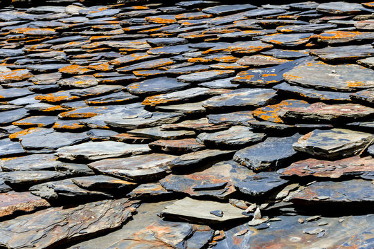 Roof built from shale stones, ancient masonry, village Dartlo Tusheti region, Georgia. Background rough texture.