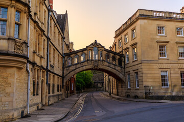 Fototapeta na wymiar Hertford Bridge, Bridge of Sighs, in Oxford at sunrise with no people around, early in the morning on a clear day with blue sky. Oxford, England, UK.