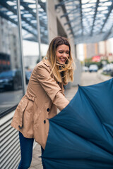 Fototapeta premium Smiling young women on a windy day