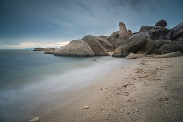 The scenery of the long-exposure of Hinta or Grandfather (Grandpa) rocks of Lamai beach in Samui island, Surat Thani, Thailand.
