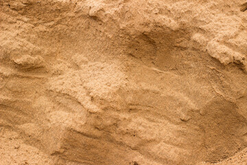 Sand layer of earth at the site of sand extraction for concrete  production. Background with sand texture.