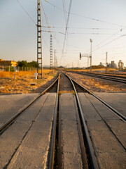 Fototapeta na wymiar Train tracks at sunset in a town in Malaga