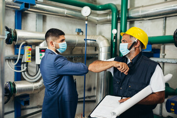 industry workers. safety handshake due covid virus