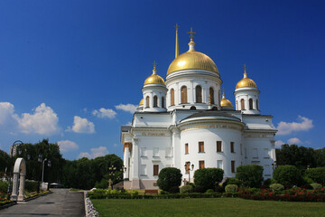 Fototapeta na wymiar Stone old Orthodox Christian church with golden domes