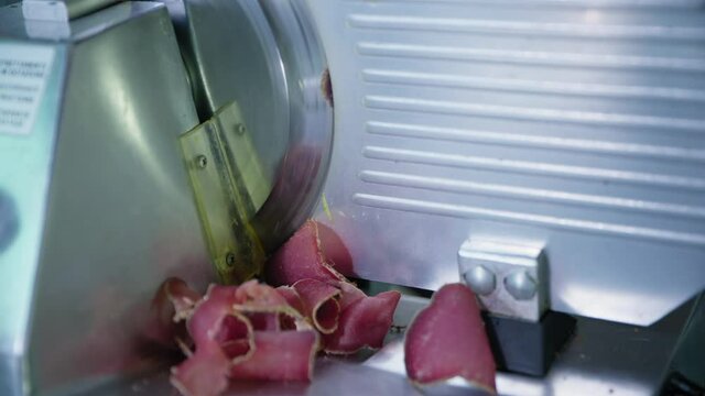 food and drinks, professional slicer for slicing meat or jamon slices for cooking in restaurant or cafe