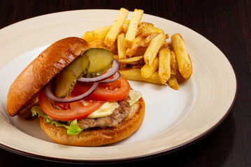 Burger with vegetables and French fries