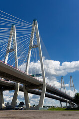 Pylons with ropes of the Bolshoy Obukhov bridge over the Neva river against the blue sky