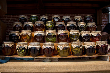 stand with different homemade honey jars. Russia, Tatarstan, Kazan, Sviyazhsk