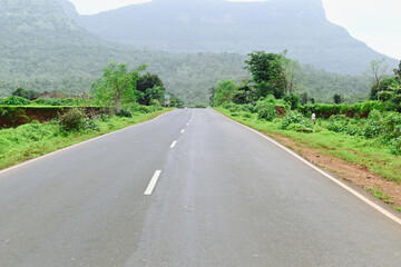 Straight road into the mountains