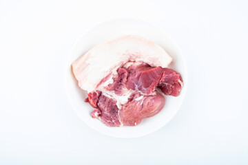 Fresh front leg pork on a plate on white background