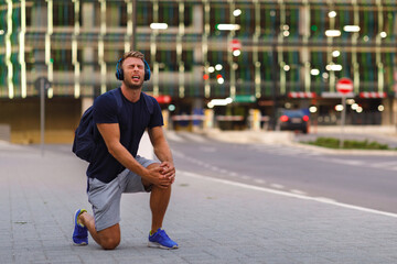 Young sports man has a ankle injury during walking in the city