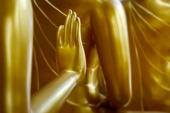 hand 's detail of   statue of buddha, in buddhist temple ,with golden color