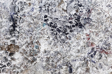 Background concrete wall, traces of weathering, worn wall damaged paint old paint. Remains of old paint on the painted concrete surface. Grungy concrete surface.