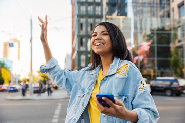 Attractive young african woman in a city street