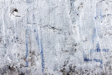 Background concrete wall, traces of weathering, worn wall damaged paint old paint. Remains of old paint on the painted concrete surface. Grungy concrete surface.