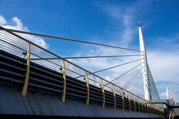 View of the Golden Horn Metro Bridge with blue sky and clouds in the background.