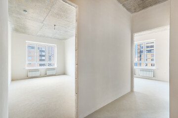 Two rooms in a new residential building without decoration and with the plastered white walls