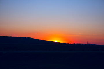 Fototapeta na wymiar Sunset over the hill . Landscape with sunset 