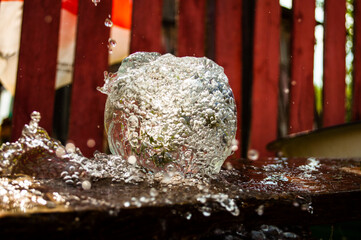 splash of water in a glass jar of water