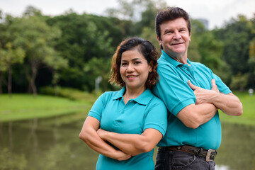 Obraz premium Happy mature multi ethnic married couple together and in love at the park