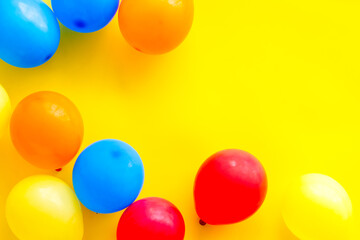 Happy birthday concept. Balloon on yellow background top-down copy space