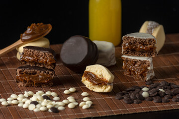 white and dark chocolate and cornstarch alfajores filled with dulce de leche