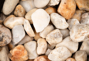 close-up of  abstract background with  pebble stones.
Texture of white stones.