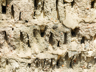 Abstract background of the old wall of black natural stone with cracks and scratches. Landscape...