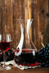 Two glasses of red wine and a decanter