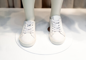 Children's shoes on a mannequin close up.