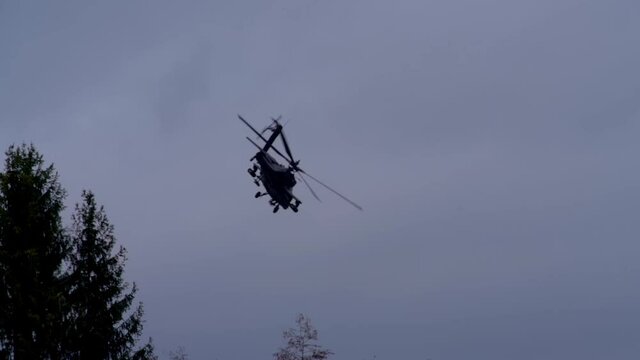AH-64 Apache helicopter flying a turn