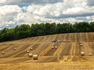 tractor and hay bales in a field