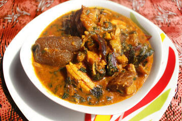 Close up of a bowl of ogbono soup. This is a popular Nigerian dish usually served with other foods...