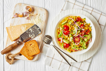 sweet corn salad with avocado in a bowl