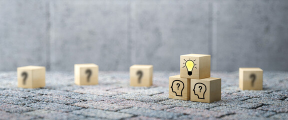 cubes showing a brainstorming session on concrete background
