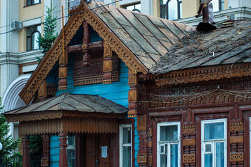 Roof of an old Russian house. Carved roof of an old house. The carving on the tree. Beautiful handmade patterns