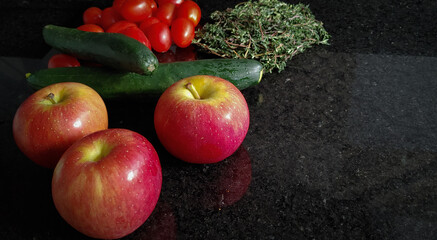 A small variety of fruits and vegetables that have just arrived from the organic fair.