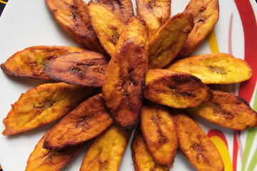 Close up view of some fried slices of plantain. Ready to eat.  © Afrofresh