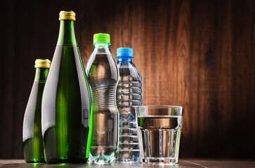 Composition with glass and bottles of mineral water