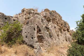Fototapeta na wymiar Remains of the ruins of the old Phoenician fortress, which later became the Roman city of Kart, near the city of Atlit in northern Israel