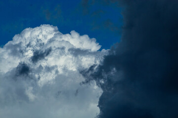 Abstract background of floating clouds. Feathers of clouds in the sky. Beautiful blue sky, bright natural background