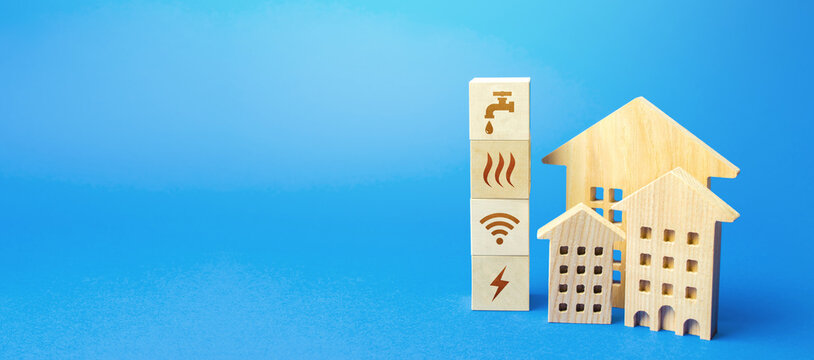 Residential buildings and blocks with communal services symbols. Utilities public service. Price, payment methods, subsidies registration. Savings, reduced environmental impact. Energy saving