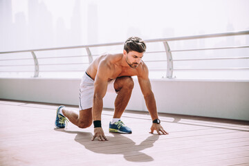 Beautiful man doing work out and different exercises outdoor