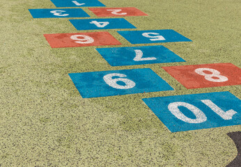 Hopscotch. Colorful numbers on playground.
