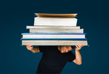 man holding a huge books