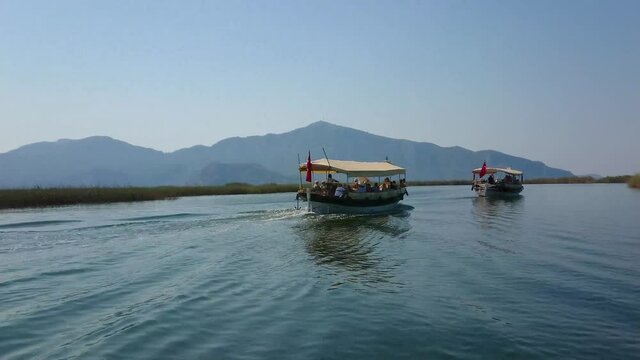boats carrying tourists on Dalyan river Turkey