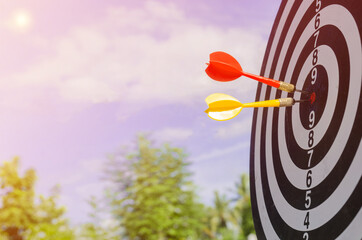 Success goals Targeting the business concept. Businessman throwing red arrow dart to virtual target...
