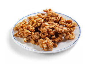 peeled walnut on a white saucer with a blue border, isolated on a white background